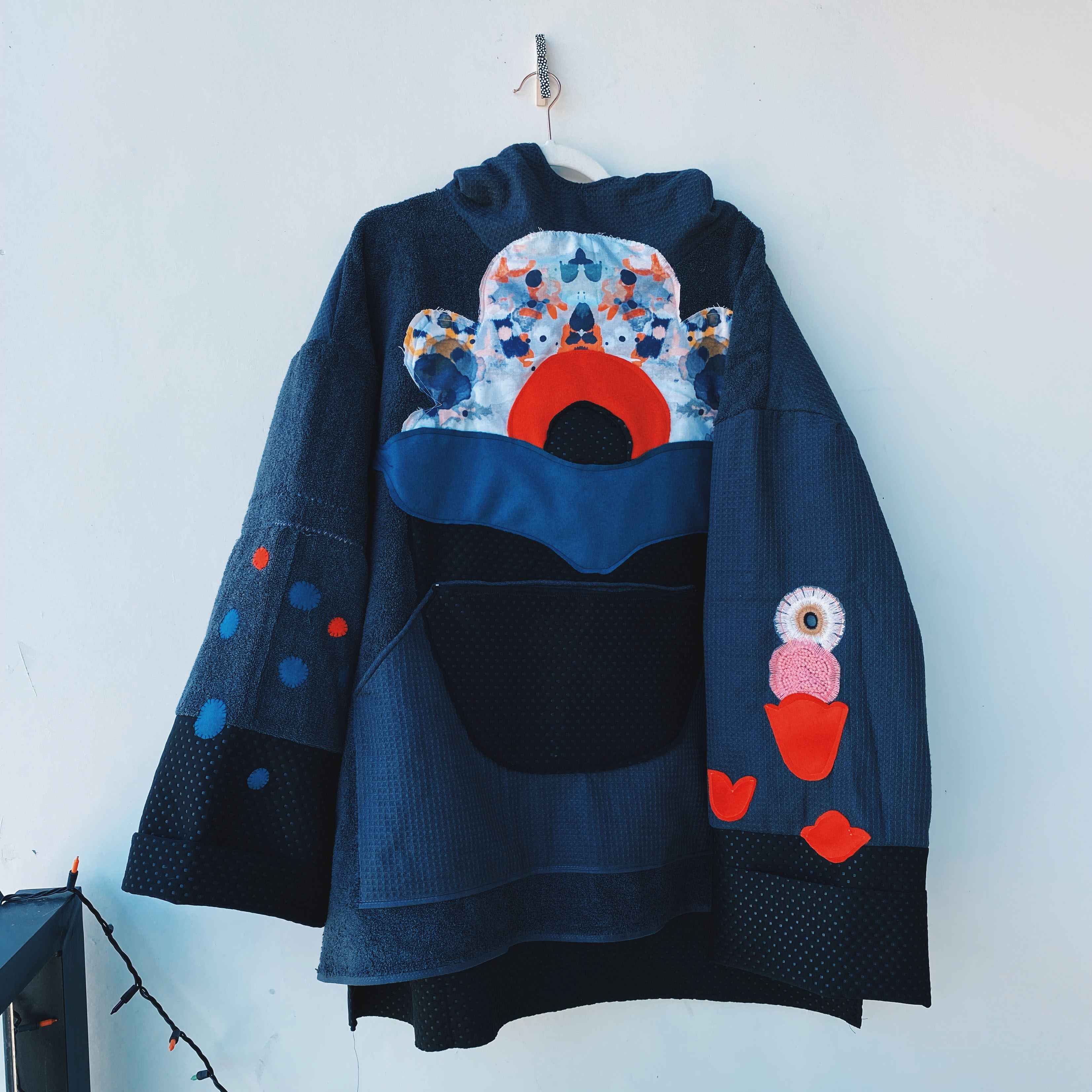 Oversized towel hoody with original flower artwork on front, sewn from towel and scrap fabric.